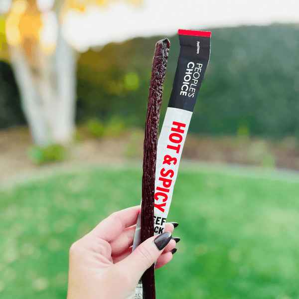 Opened beef jerky stick hot and spicy. 
