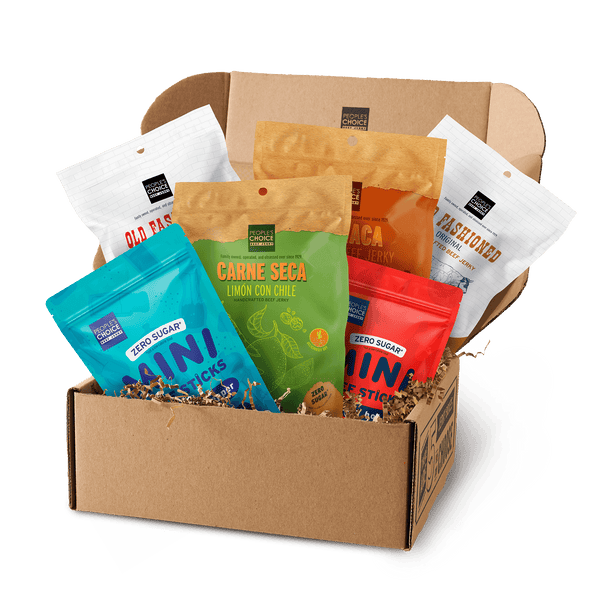 Branded box with assortment of beef jerky bags in it while against a transparent background. 