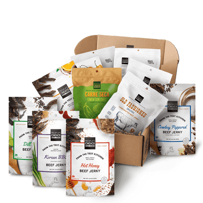 Branded box with assortment of beef jerky bags in it while against a transparent background. 