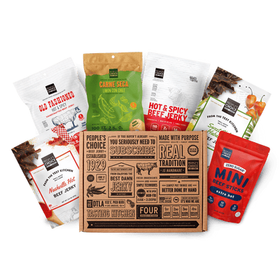 Branded box with assortment of beef jerky bags in it while against a transparent background. 
