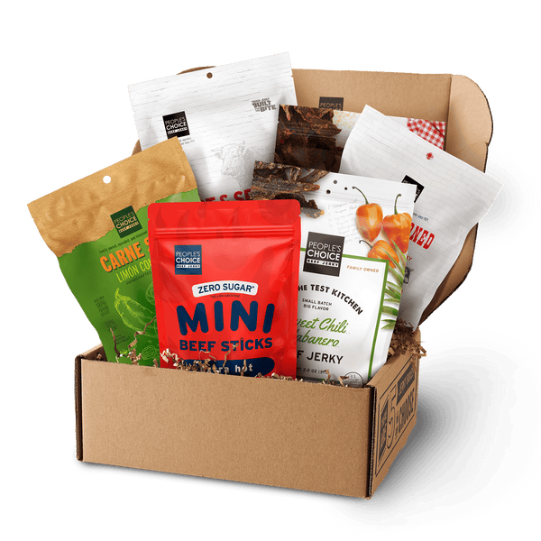 Branded box with assortment of beef jerky bags in it while against a transparent background. 