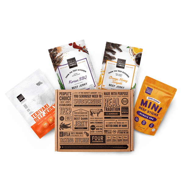 Branded box with assortment of beef jerky bags in it while against a transparent background. 