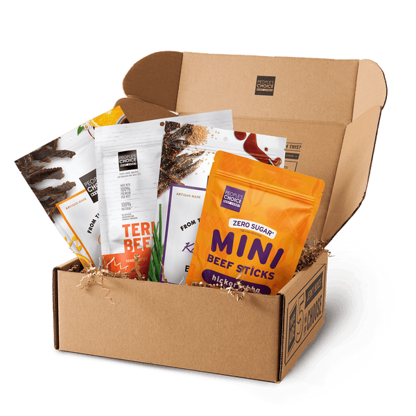 Branded box with assortment of beef jerky bags in it while against a transparent background. 