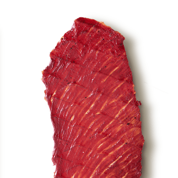 Slab of beef jerky on a transparent background. 