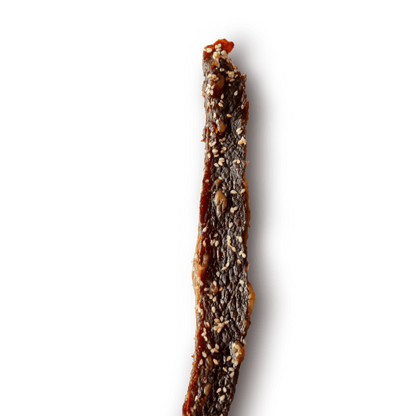 Close-up of a textured, Korean BBQ beef jerky piece on a transparent background