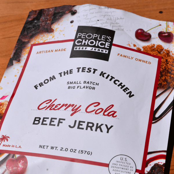 People's Choice Cherry Cola Beef Jerky package on a wooden surface